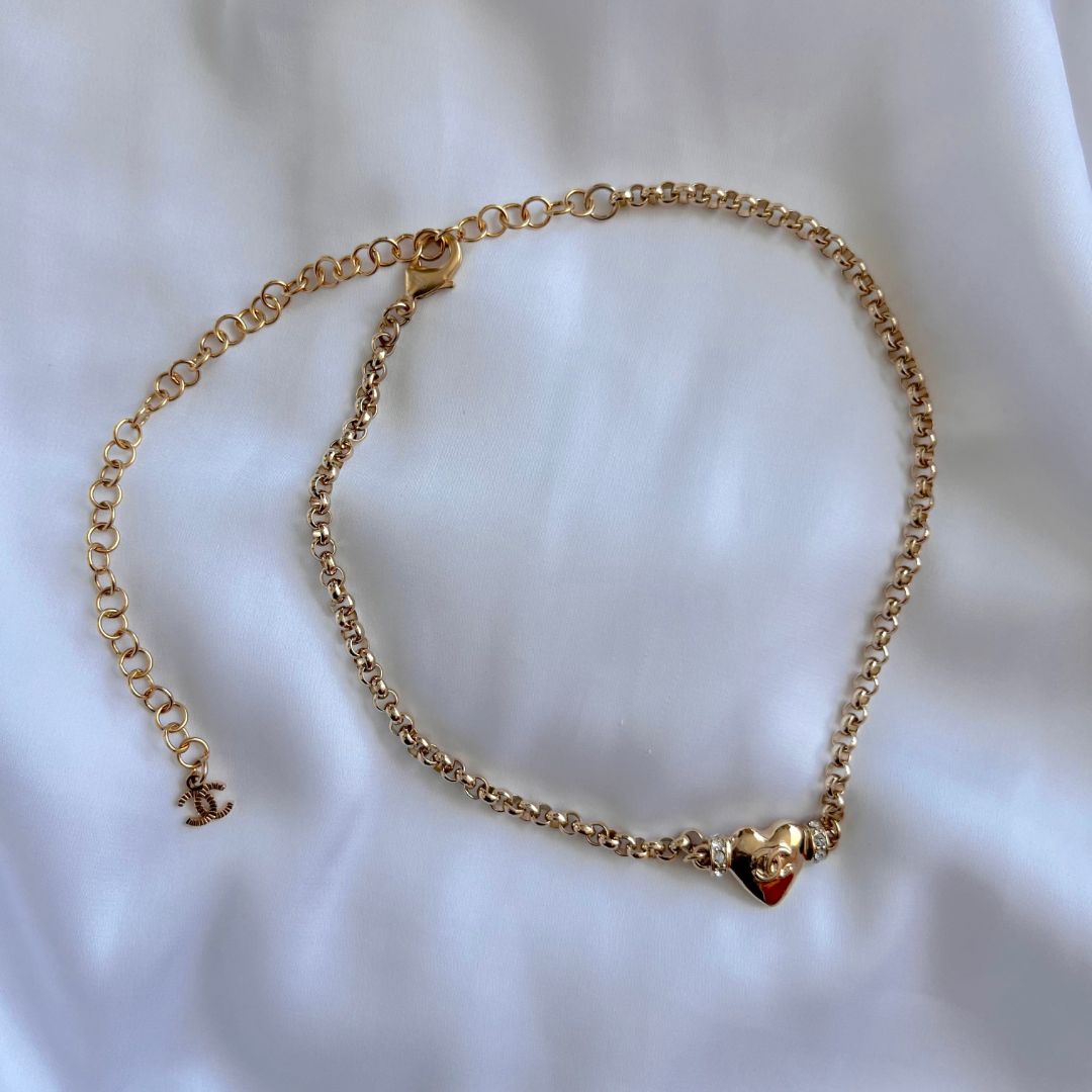 Chanel gold chain necklace with heart pendant and crystal detail
