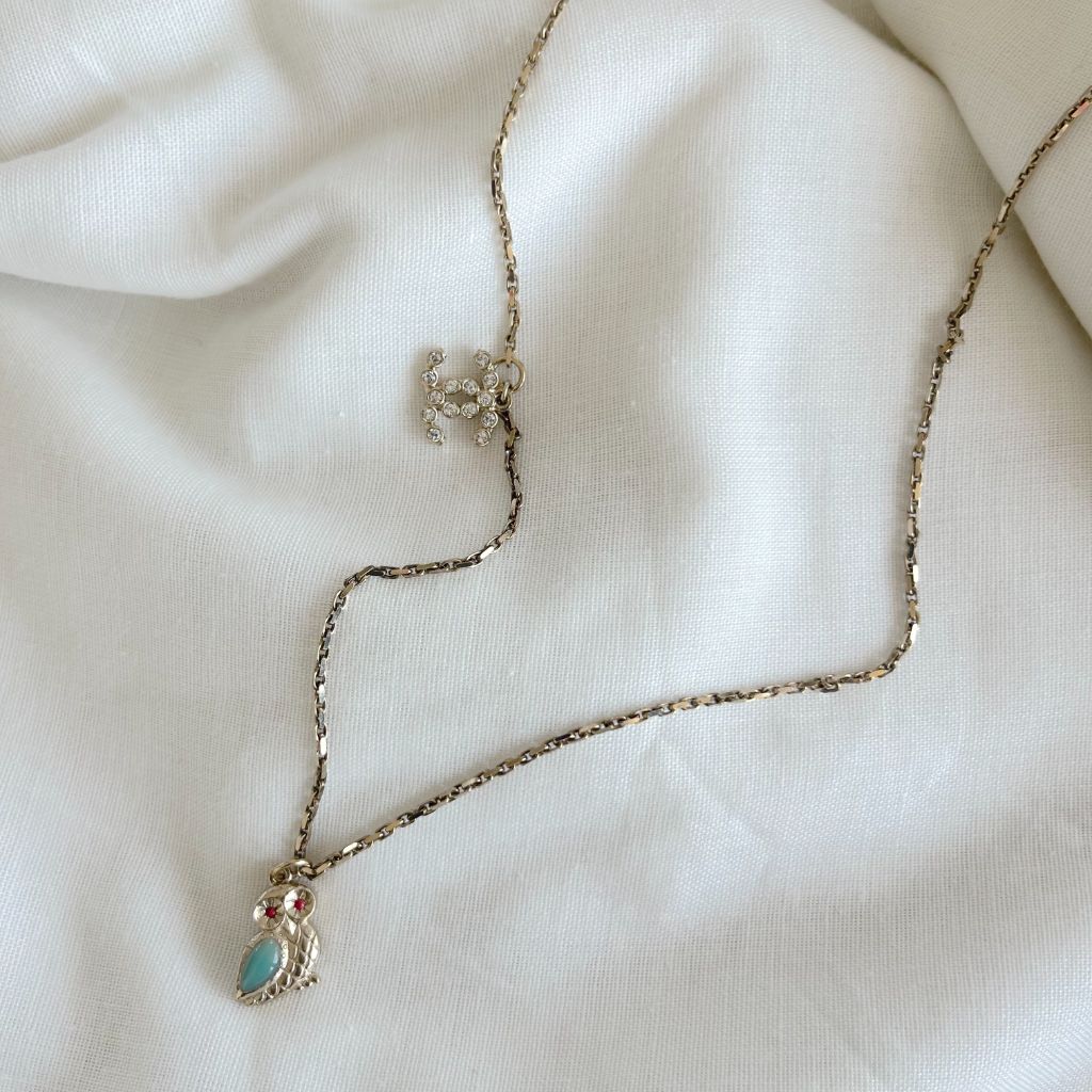 Chanel light gold-tone chain necklace with CC charm and owl charms
