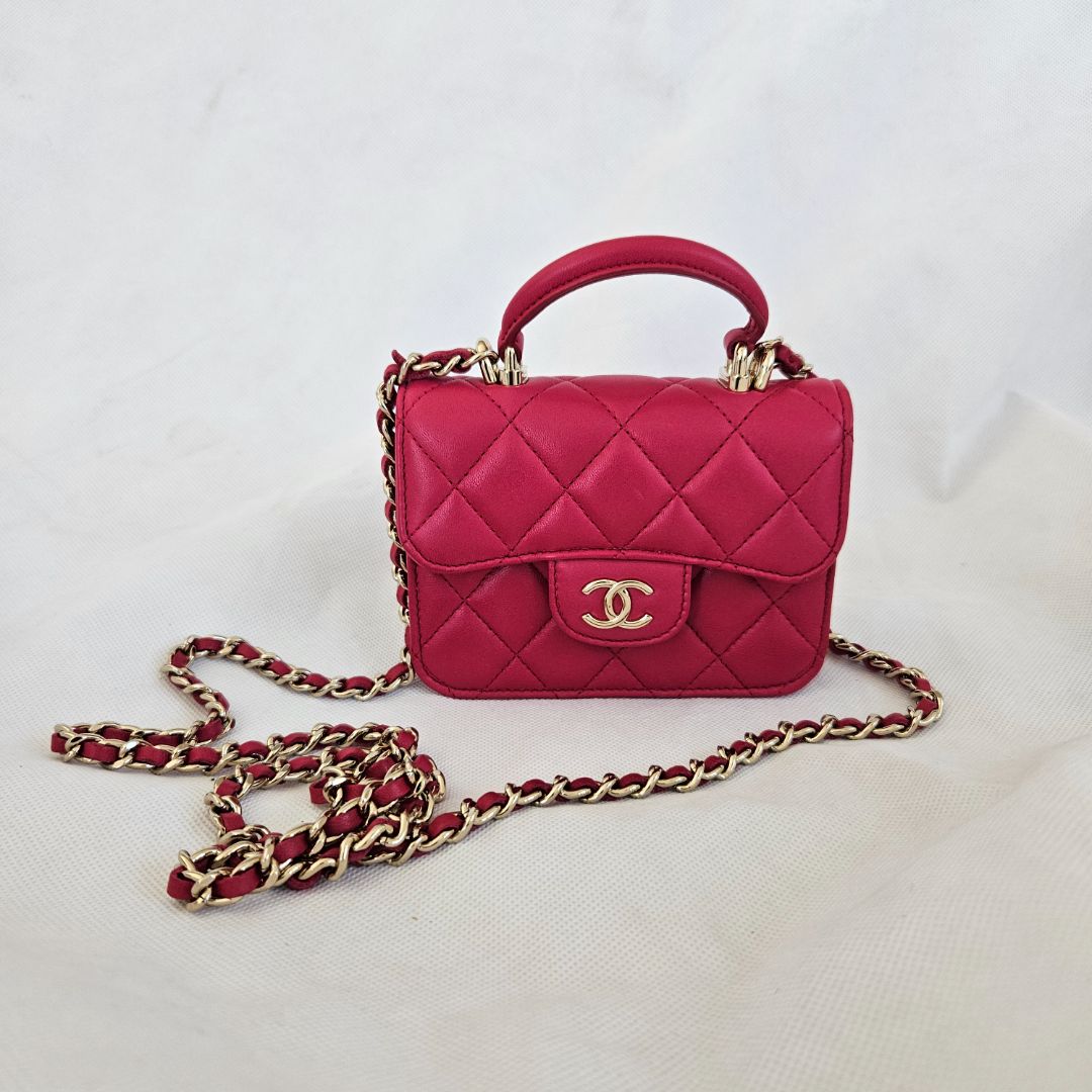 Chanel dark pink quilted lambskin top handle micro top handle flap bag