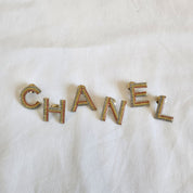 CHANEL crystal embellished Letter brooch