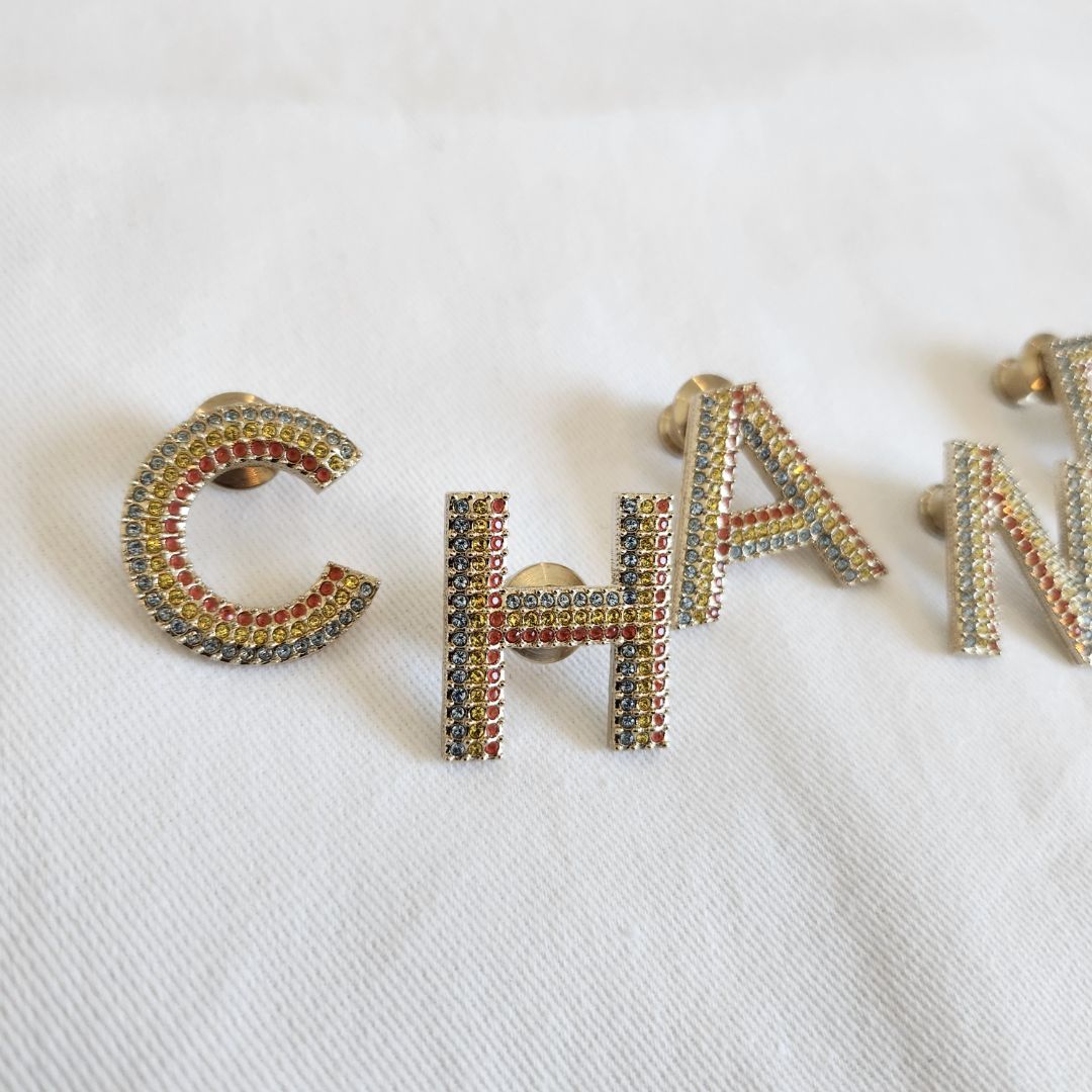 CHANEL crystal embellished Letter brooch