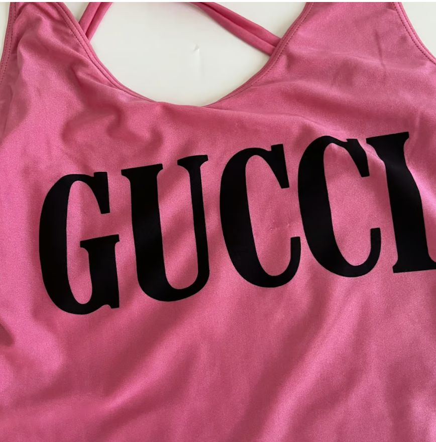 Gucci pink one piece bathing suit with GUCCI logo