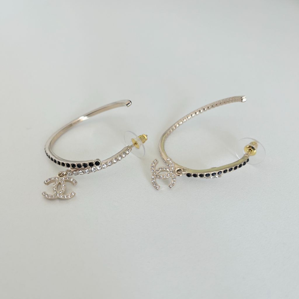 Chanel curved hoop earrings with white and black crystals