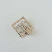 Chanel square gold crystal embellished brooch with lock cc pendant