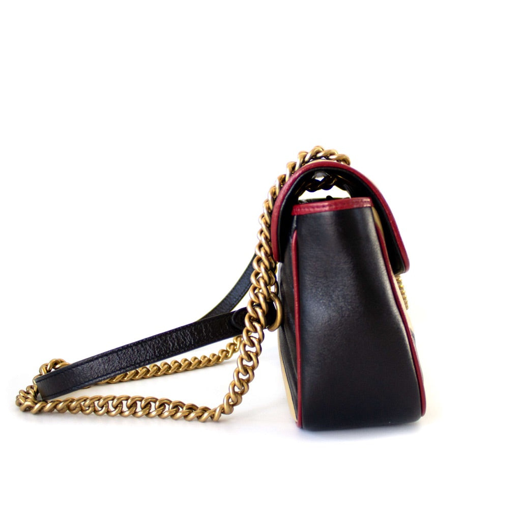 Gucci GG Marmont Small shoulder bag in black and beige quilted leather and red piping