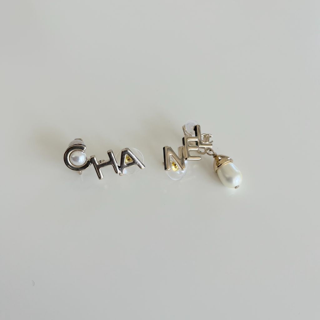 Chanel light gold CHA - NEL stud earrings