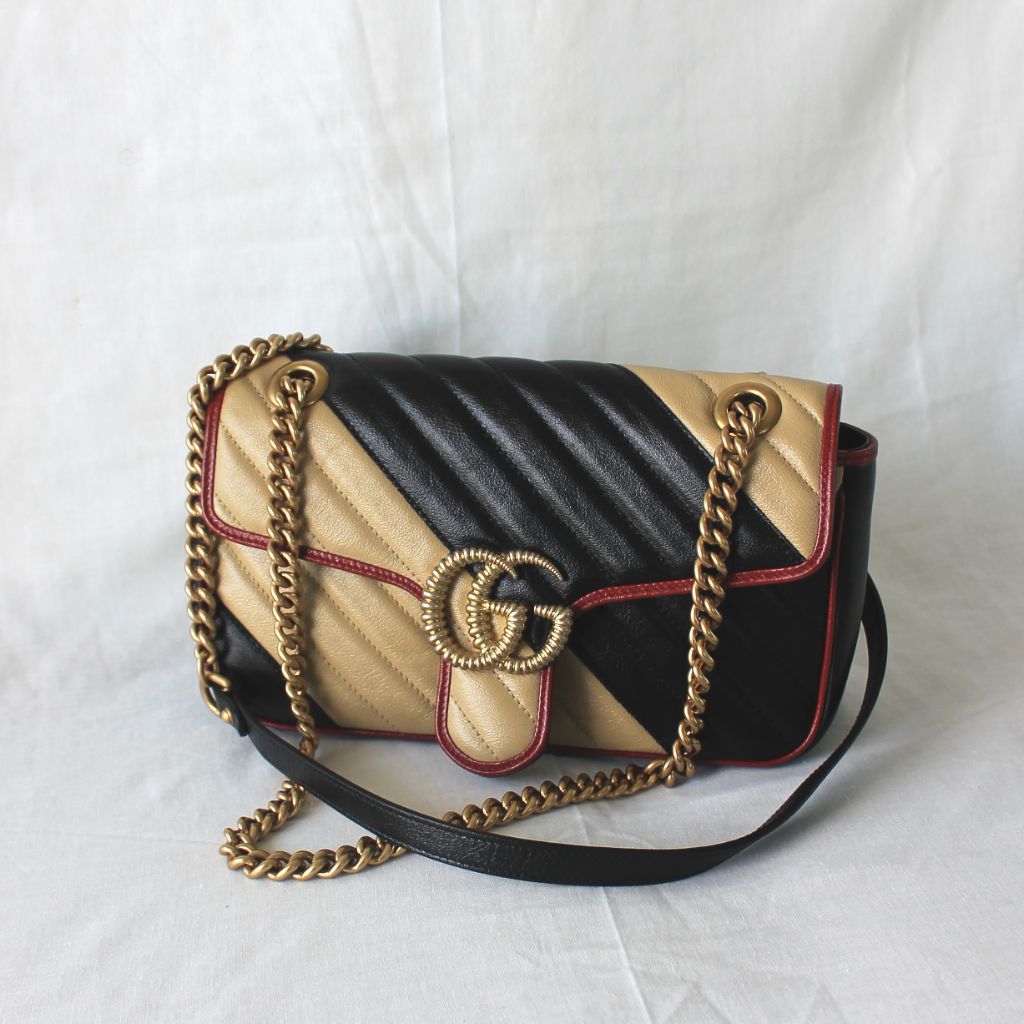 Gucci GG Marmont Small shoulder bag in black and beige quilted leather and red piping