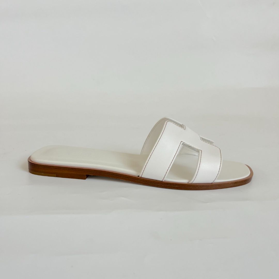 Hermès white oran flat slides, 37