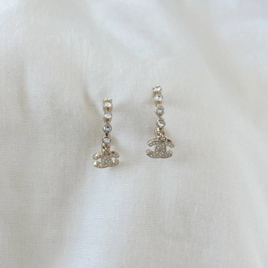 Chanel crystal half hoop earrings with dangling crystal embellished cc charm
