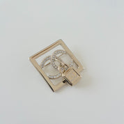 Chanel square gold crystal embellished brooch with lock cc pendant