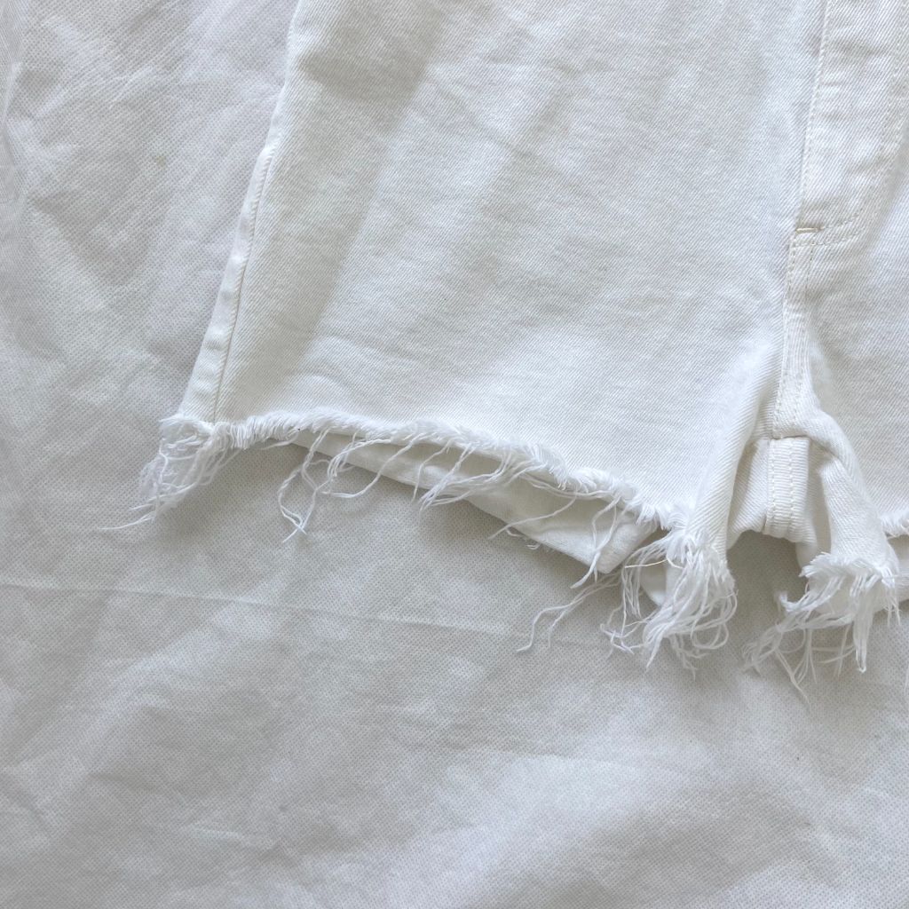 Stella McCartney white denim shorts with frayed edges