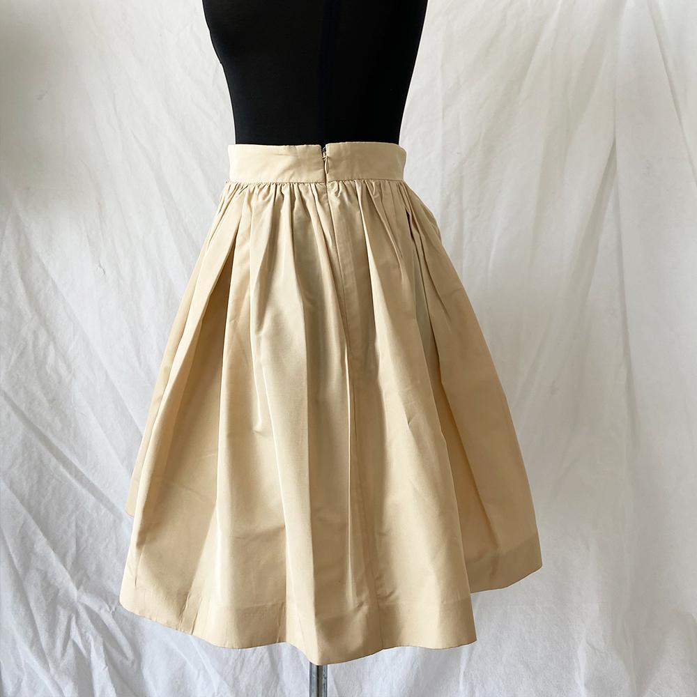 Miu Miu beige pleated mini skirt - BOPF | Business of Preloved Fashion