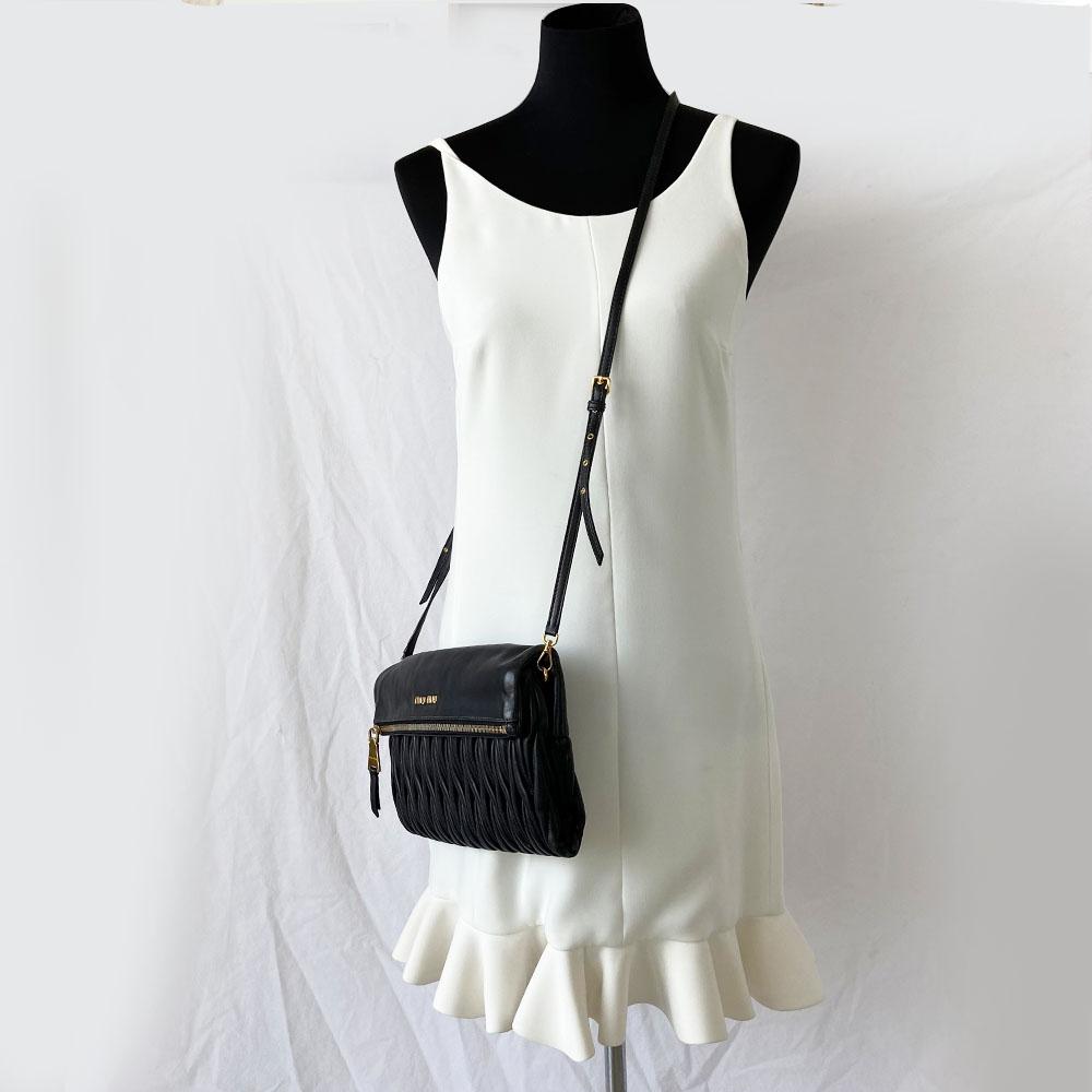Miu Miu black leather matelasse fold over clutch bag - BOPF | Business of Preloved Fashion