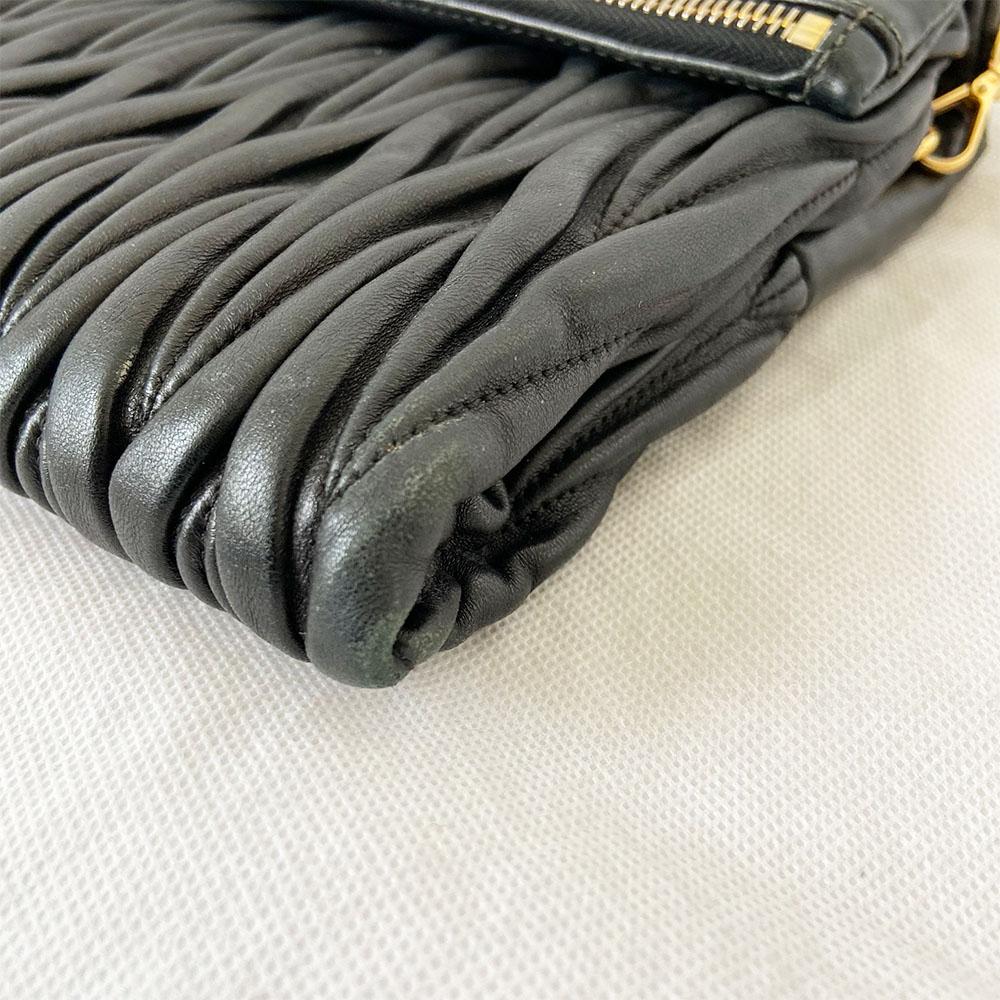 Miu Miu black leather matelasse fold over clutch bag - BOPF | Business of Preloved Fashion