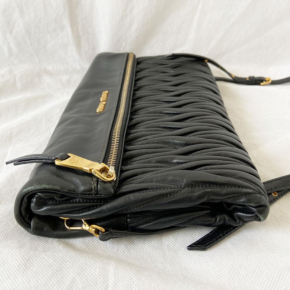 Miu Miu black leather matelasse fold over clutch bag - BOPF | Business of Preloved Fashion
