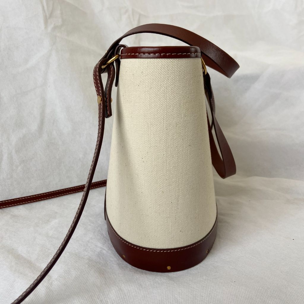 The Row beige canvas and leather bucket bag BOPF Business of